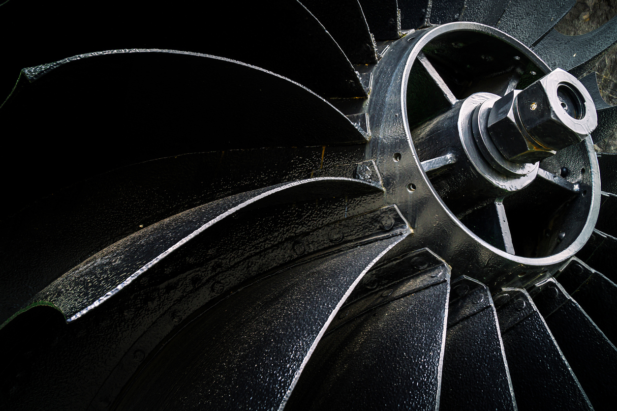 “nOld riveted mine fan. Front view of the impeller and fan blades. Macro.