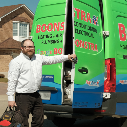Boonstra technician standing by our famous green trucks in a residential neighbourhood. Boonstra technician standing by our famous green trucks in a residential neighbourhood.